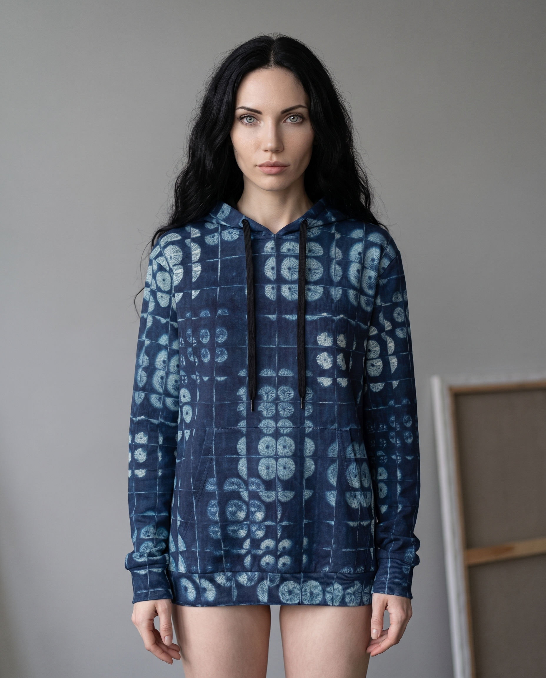Freya wearing Spore Shibori pullover hoodie in a studio